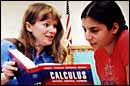 Teacher and student with calculus book