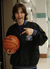 Zach poses with a basketball 